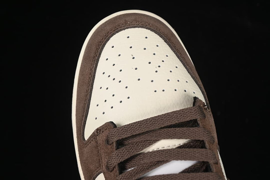 Top-down view of the perforated off-white toe and brown laces