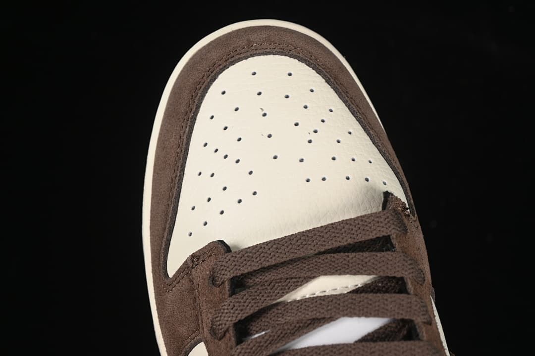 Top-down view of the perforated off-white toe and brown laces