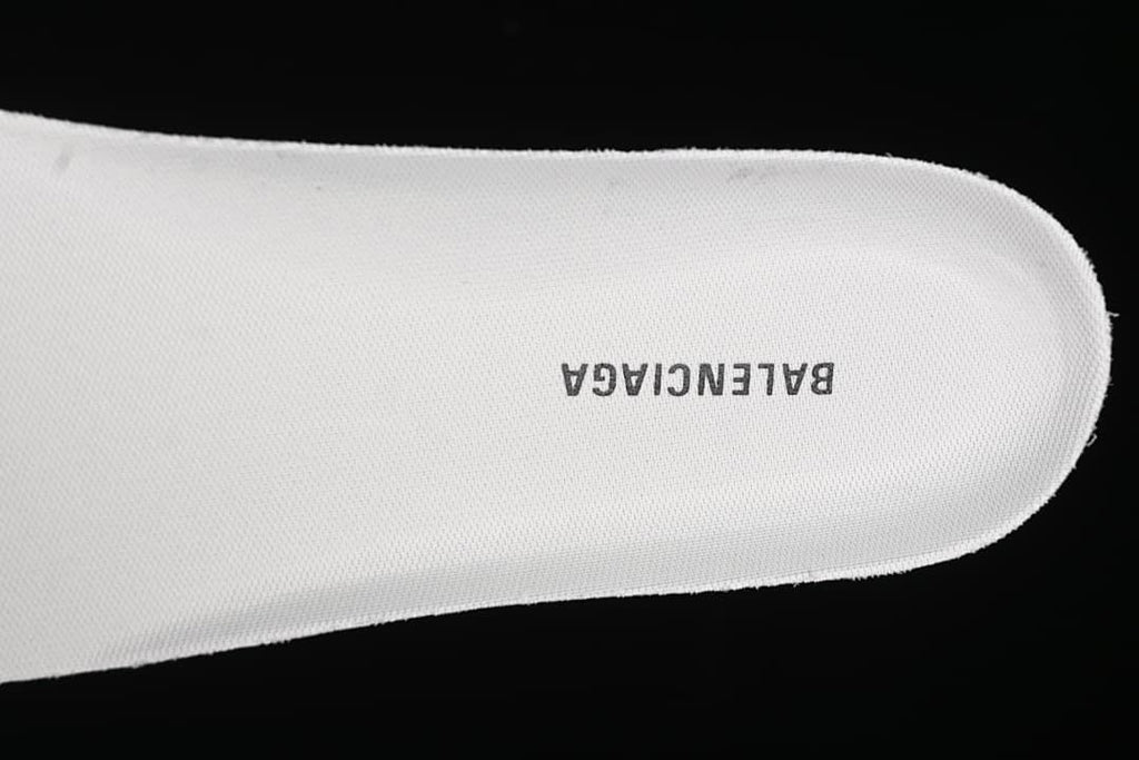 Close-up of a white shoe insert marked Balenciaga.