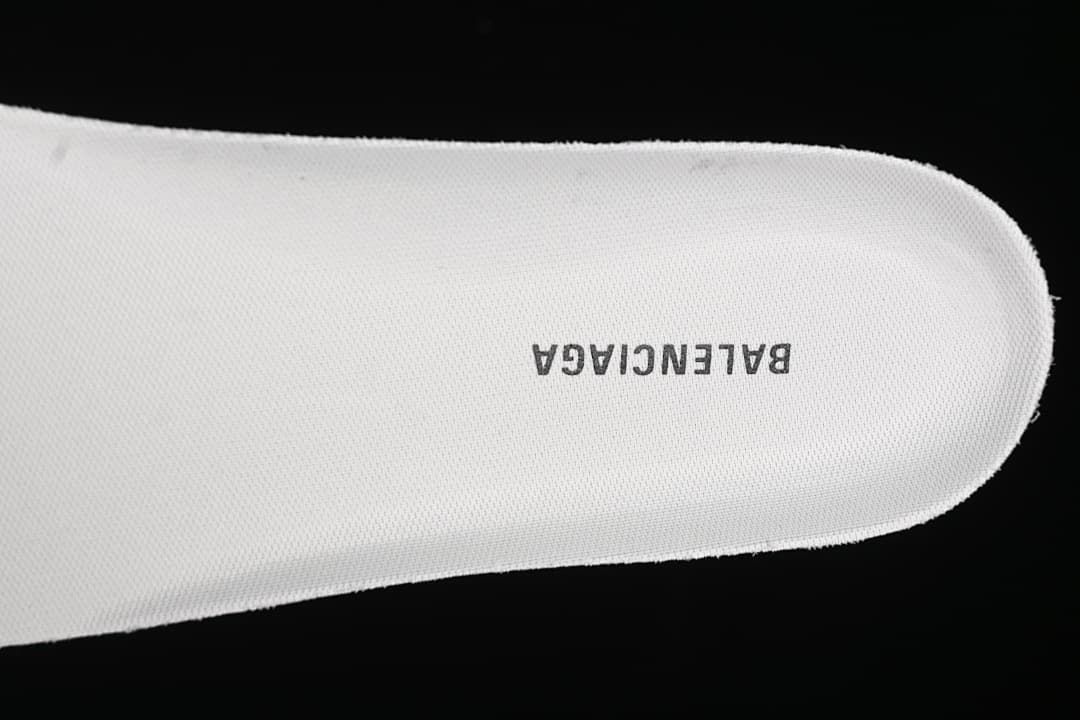 Close-up of a white shoe insert marked Balenciaga.
