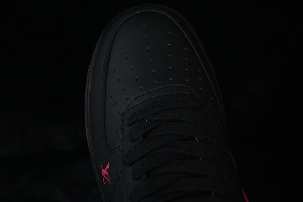 Top-down close-up of the perforated black toe and laces