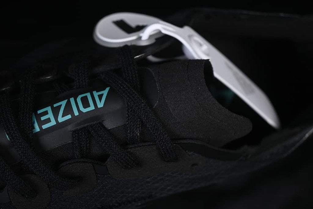 Close-up of the tongue and black lace-up closure