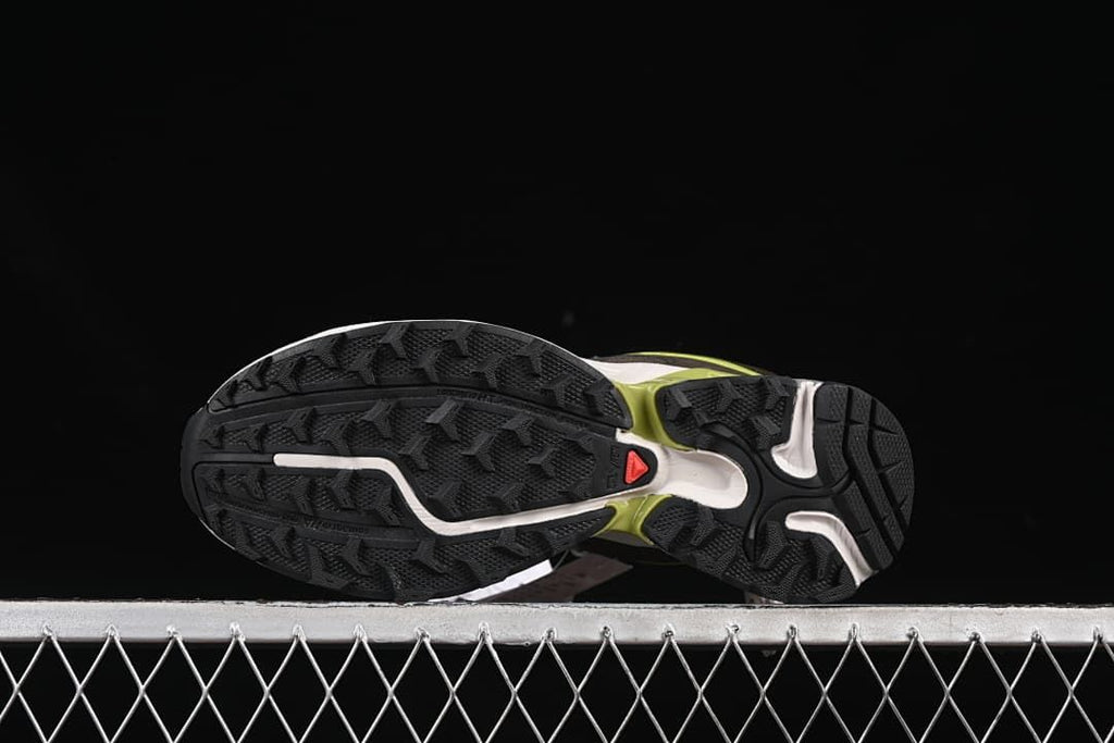 Underside view showing the patterned lugged outsoles