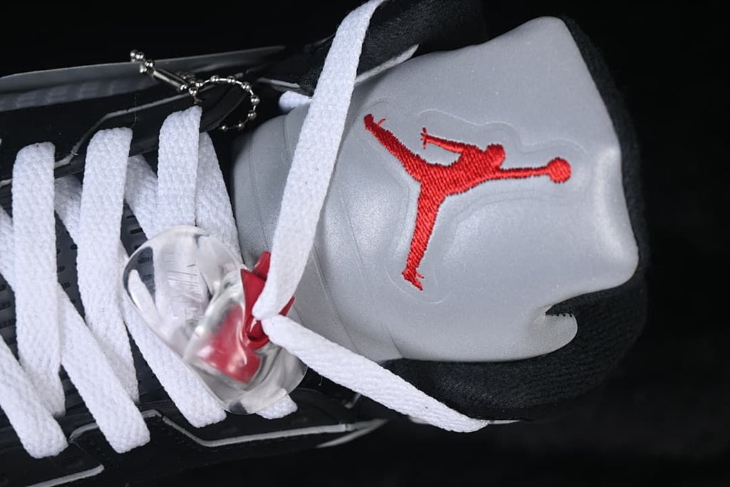 Close-up of the gray tongue with red Jumpman embroidery and clear lace lock