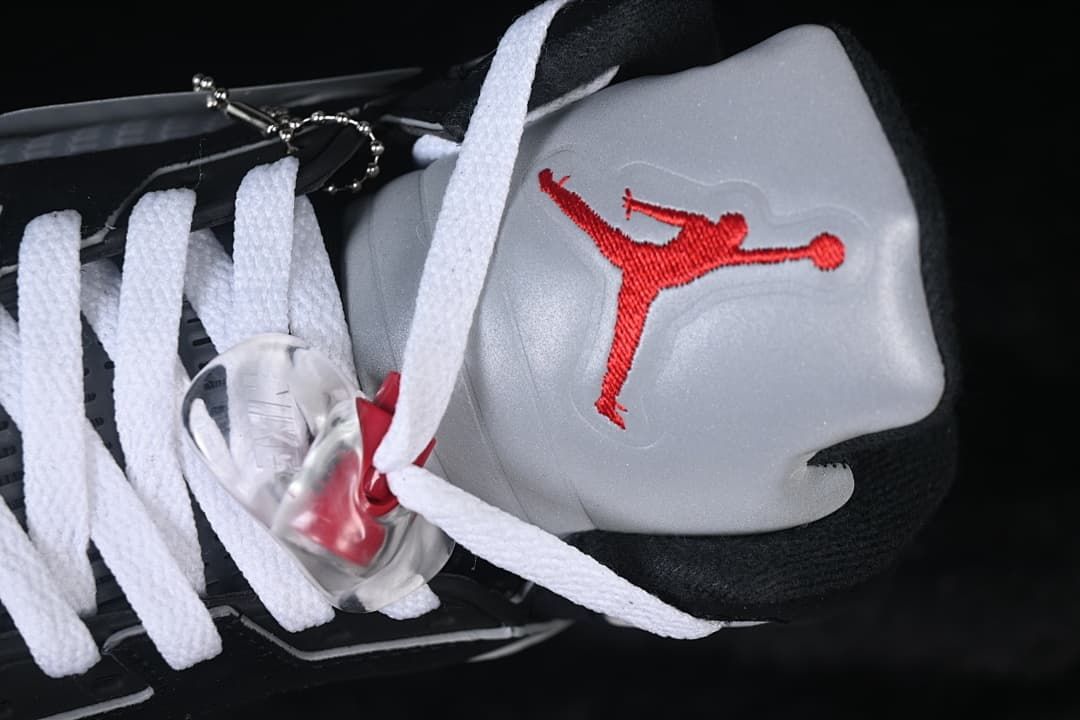Close-up of the gray tongue with red Jumpman embroidery and clear lace lock