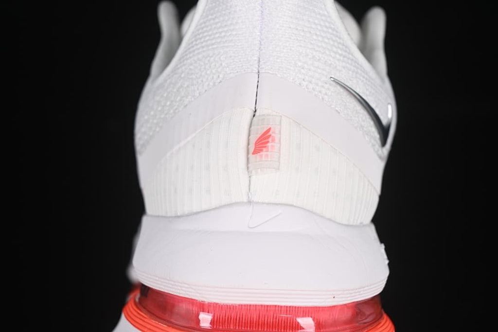 Rear view highlighting the heel and red cushioning unit.