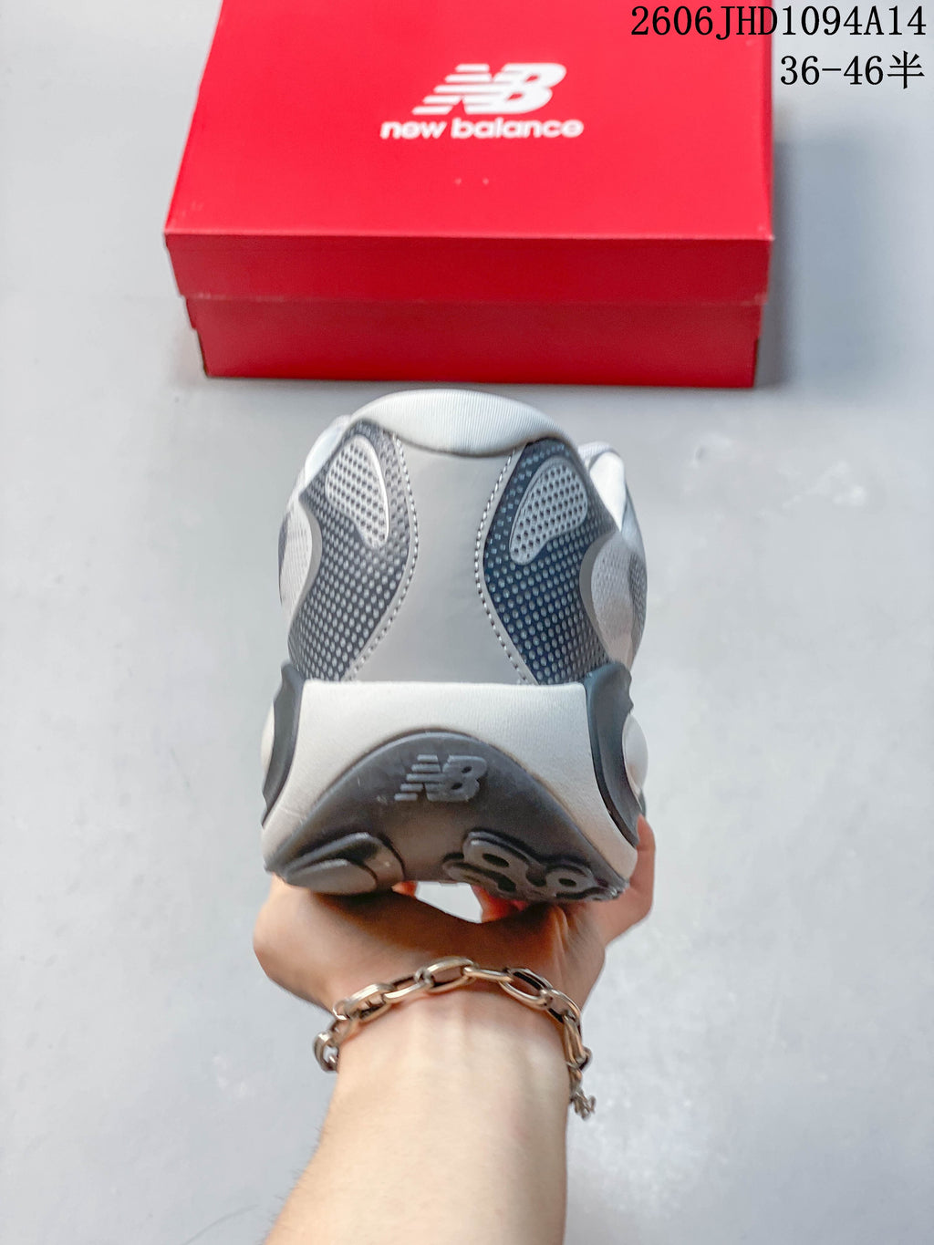 Rear view of the gray sneaker showing the heel construction