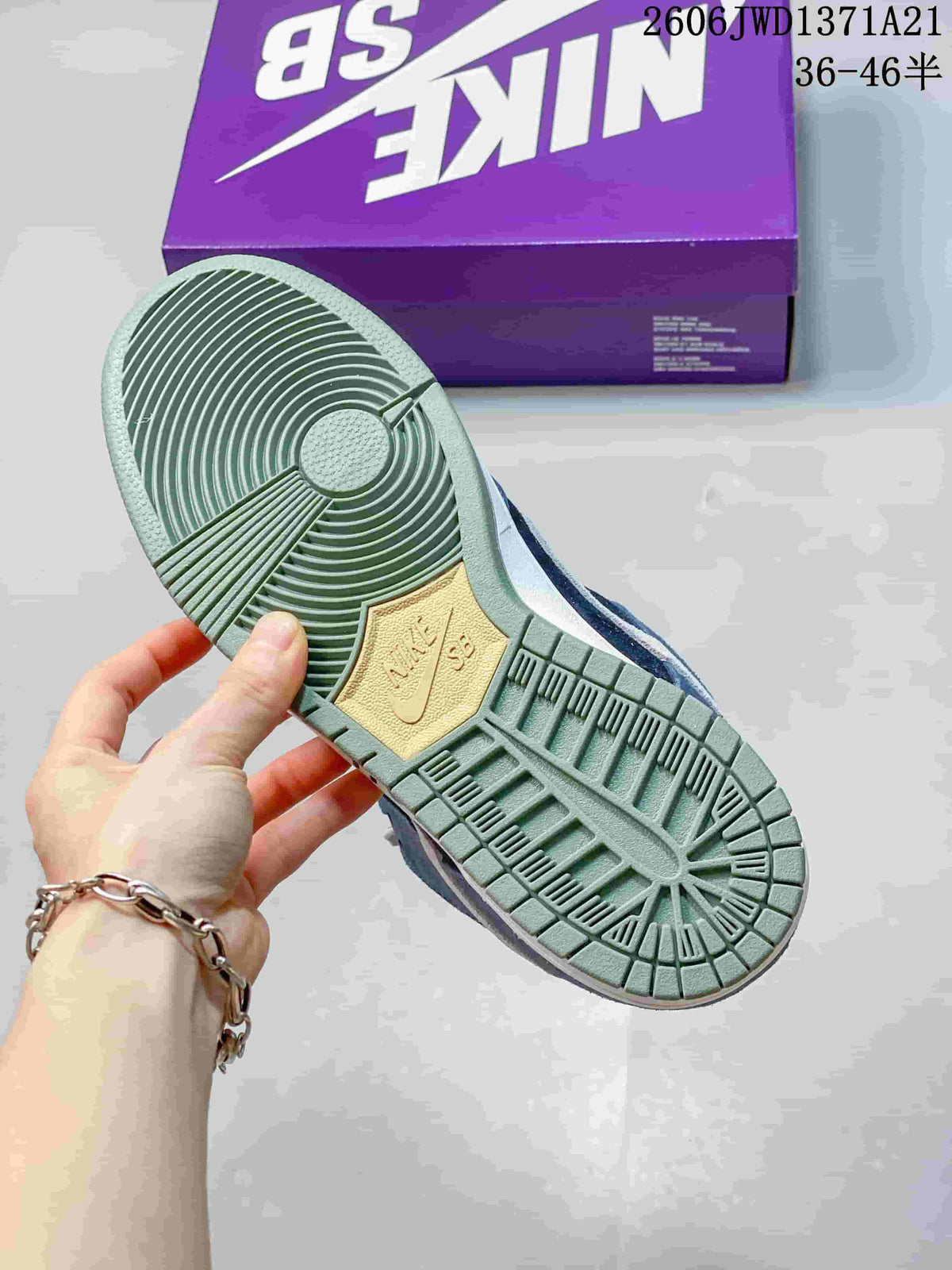 Close view of the green-patterned outsole of a Nike SB Dunk Low Pro sneaker.