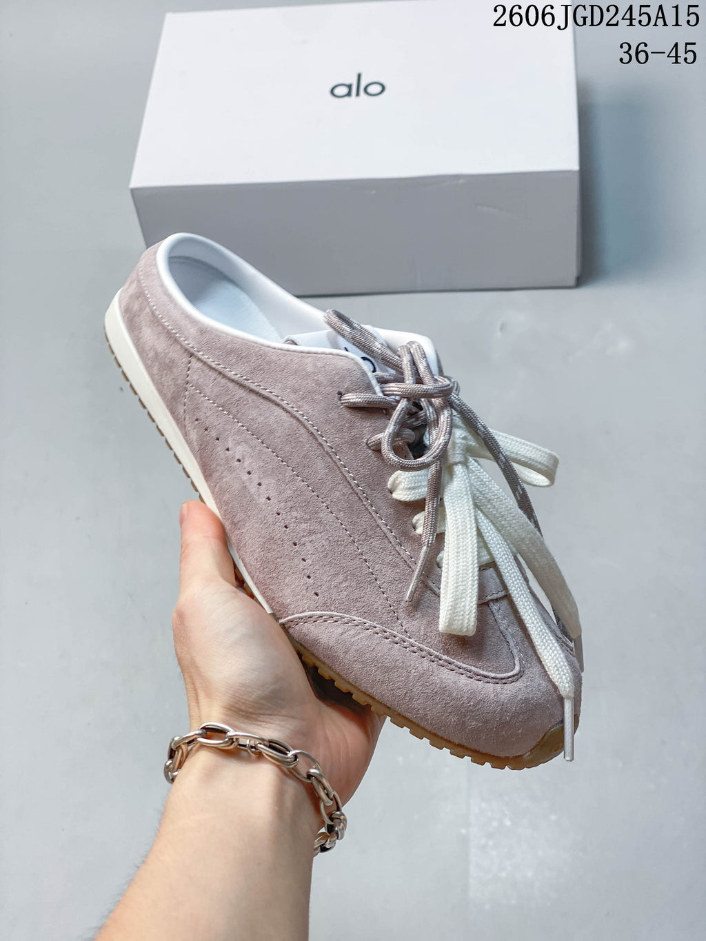 Side view of the sneaker with its low-profile shape and perforated details