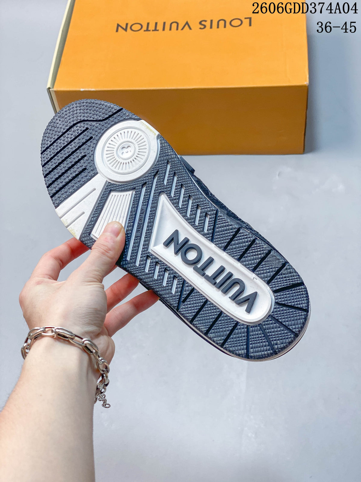 Outsole view of a white and navy Louis Vuitton Trainer sneaker.