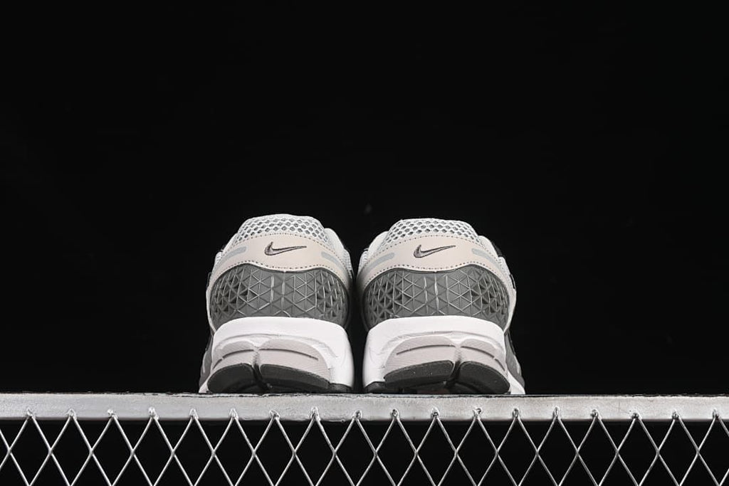 Rear view of both shoes showing the heel panels.