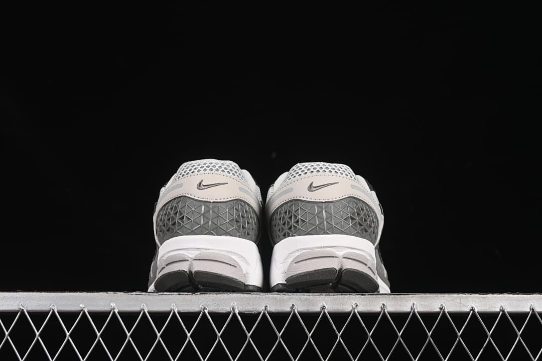 Rear view of both shoes showing the heel panels.