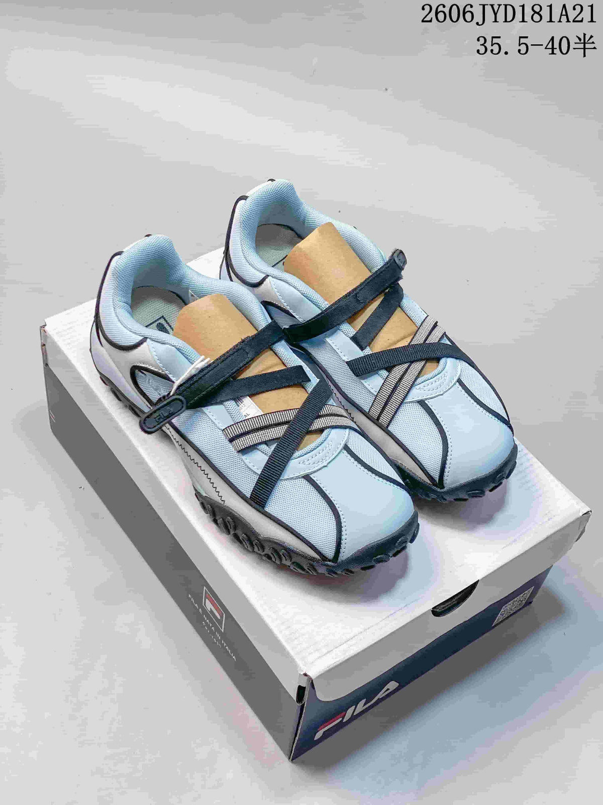 Three color variations of FILA Pebble Sandal shoes shown from the side