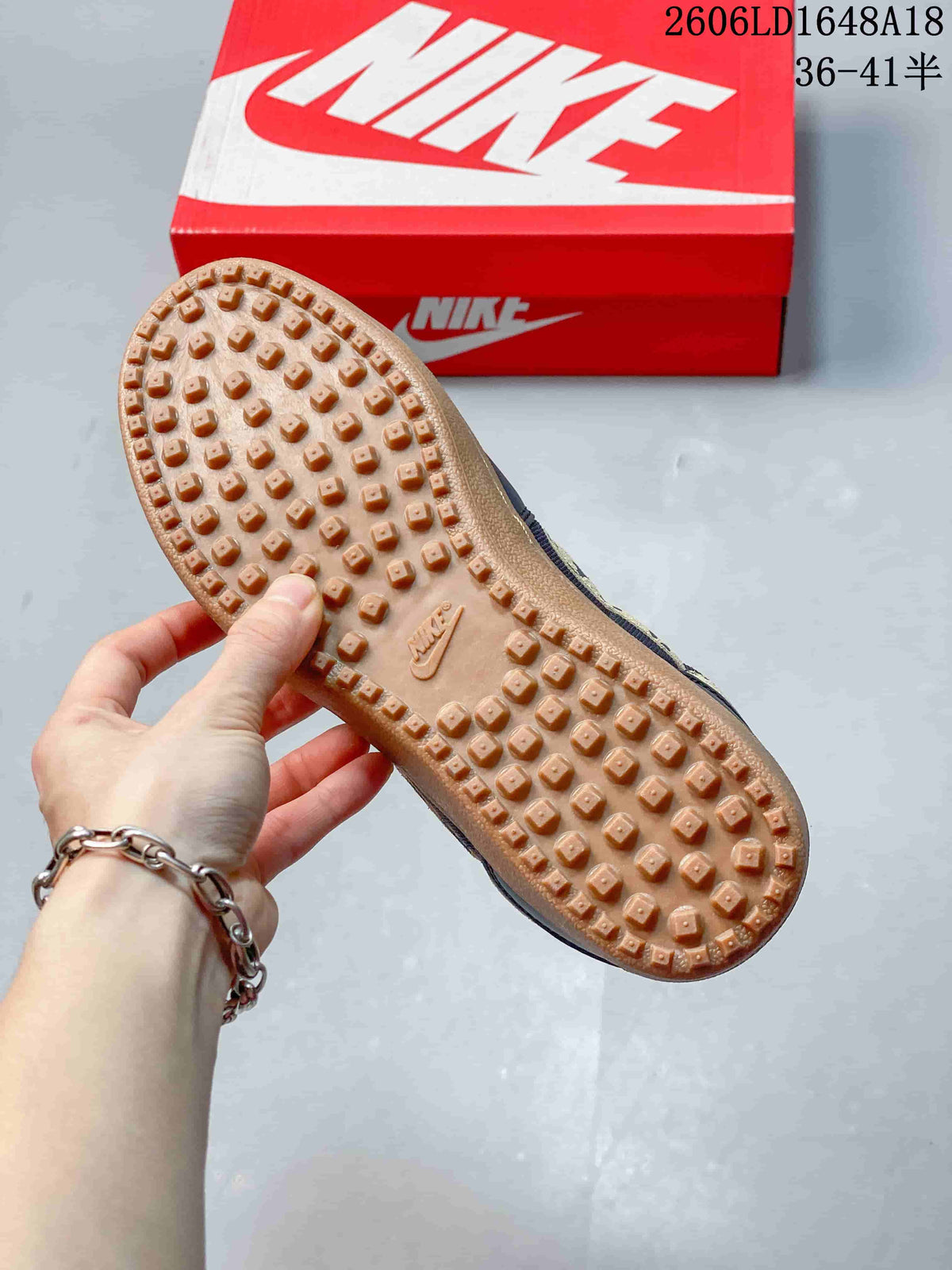 Underside view showing the textured gum-colored outsole of the Nike sneaker