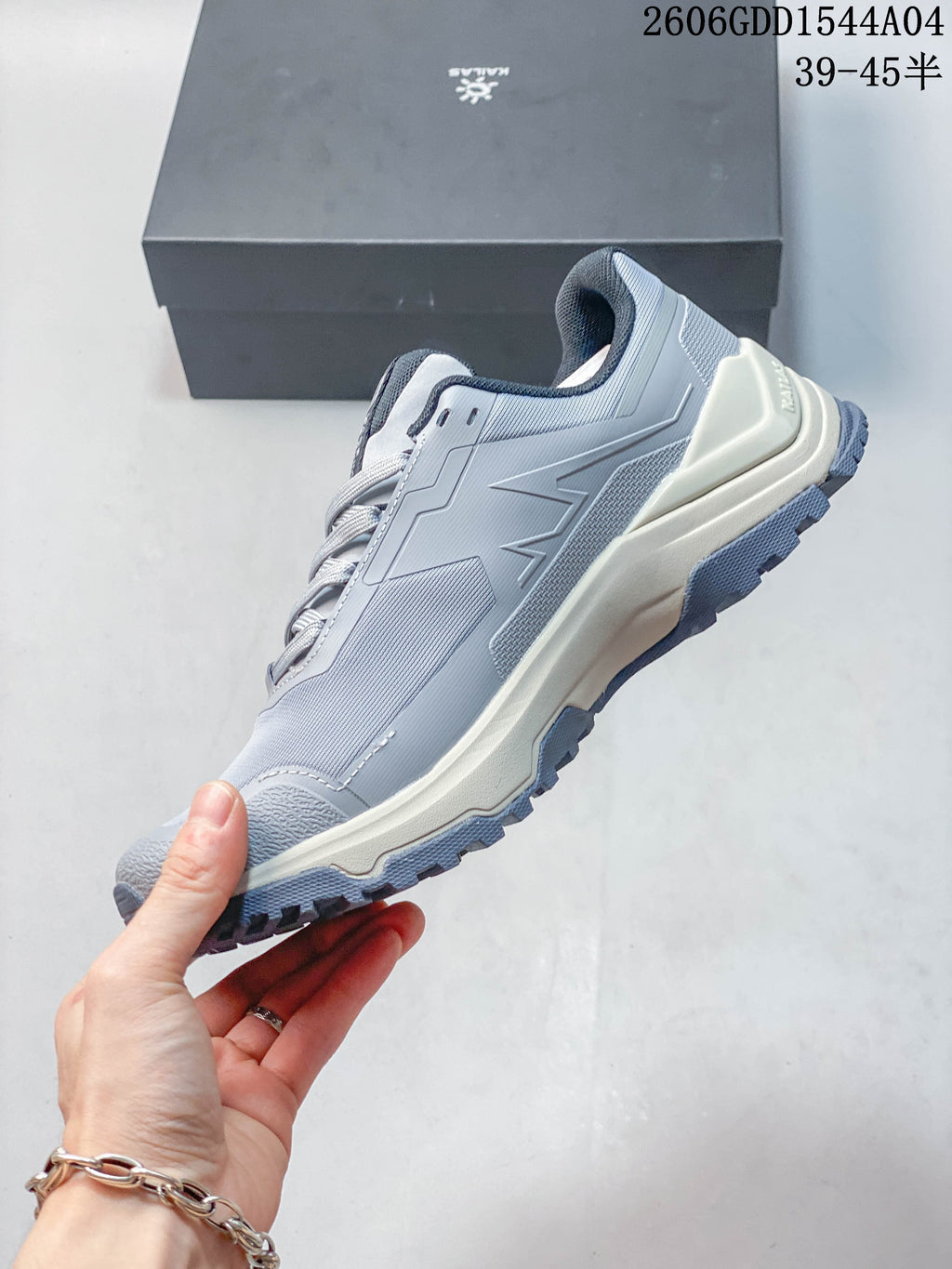 Side profile of a light grey KAILAS low-top hiking shoe.