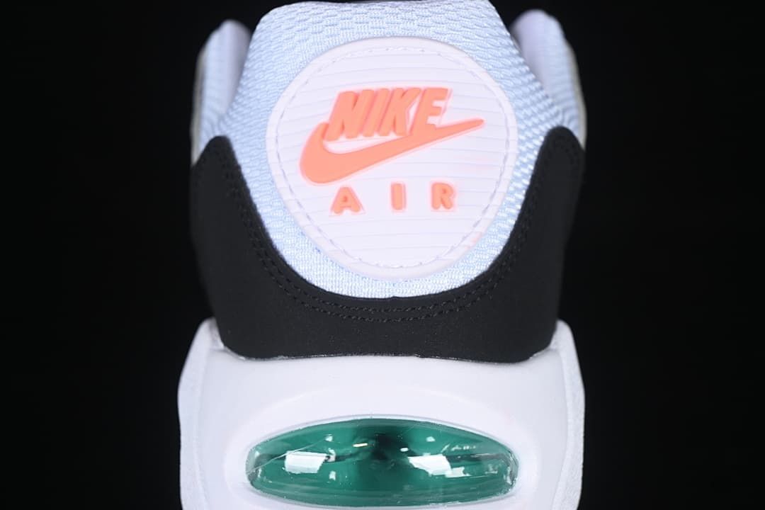 Rear view highlighting the coral Nike Air heel emblem and visible heel air unit.
