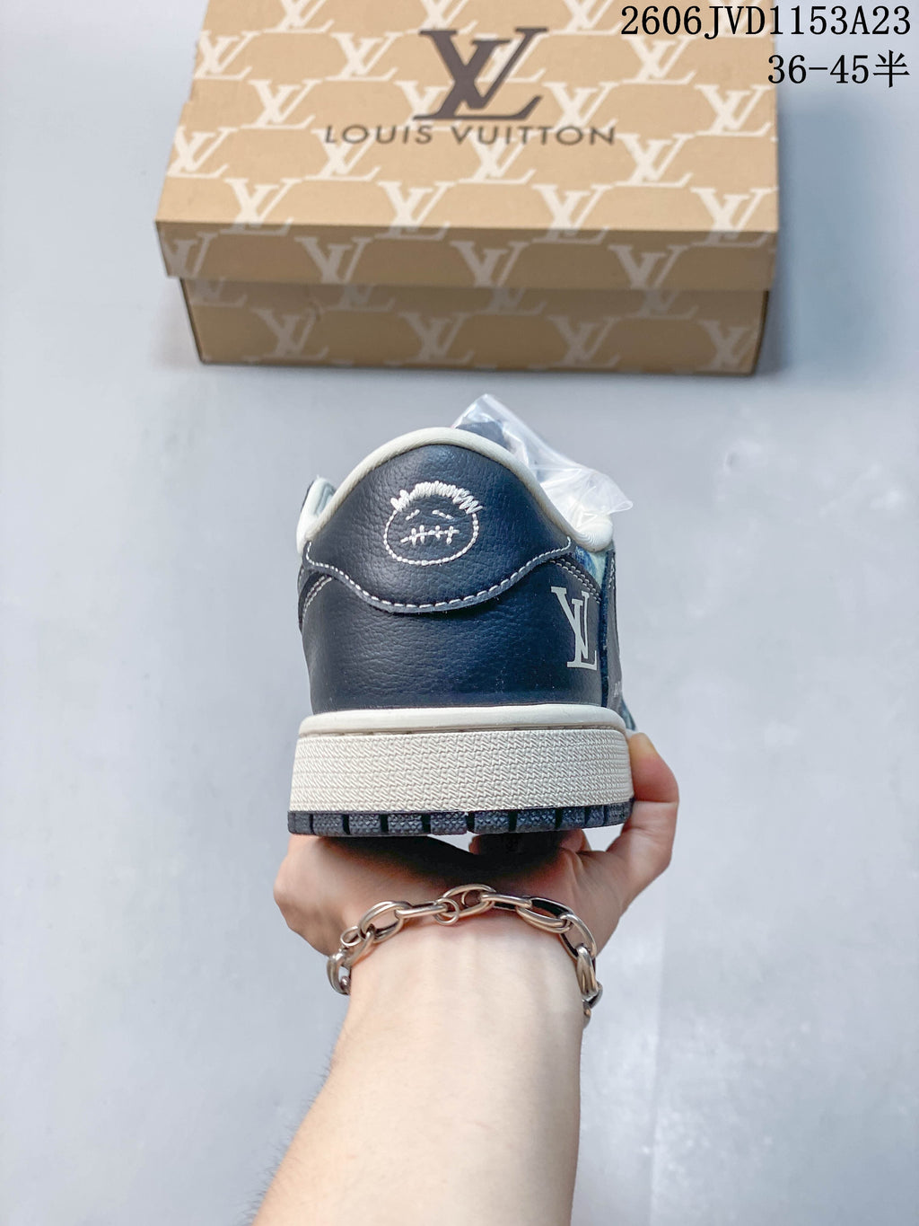 Rear view showing a dark navy heel panel and light-colored midsole