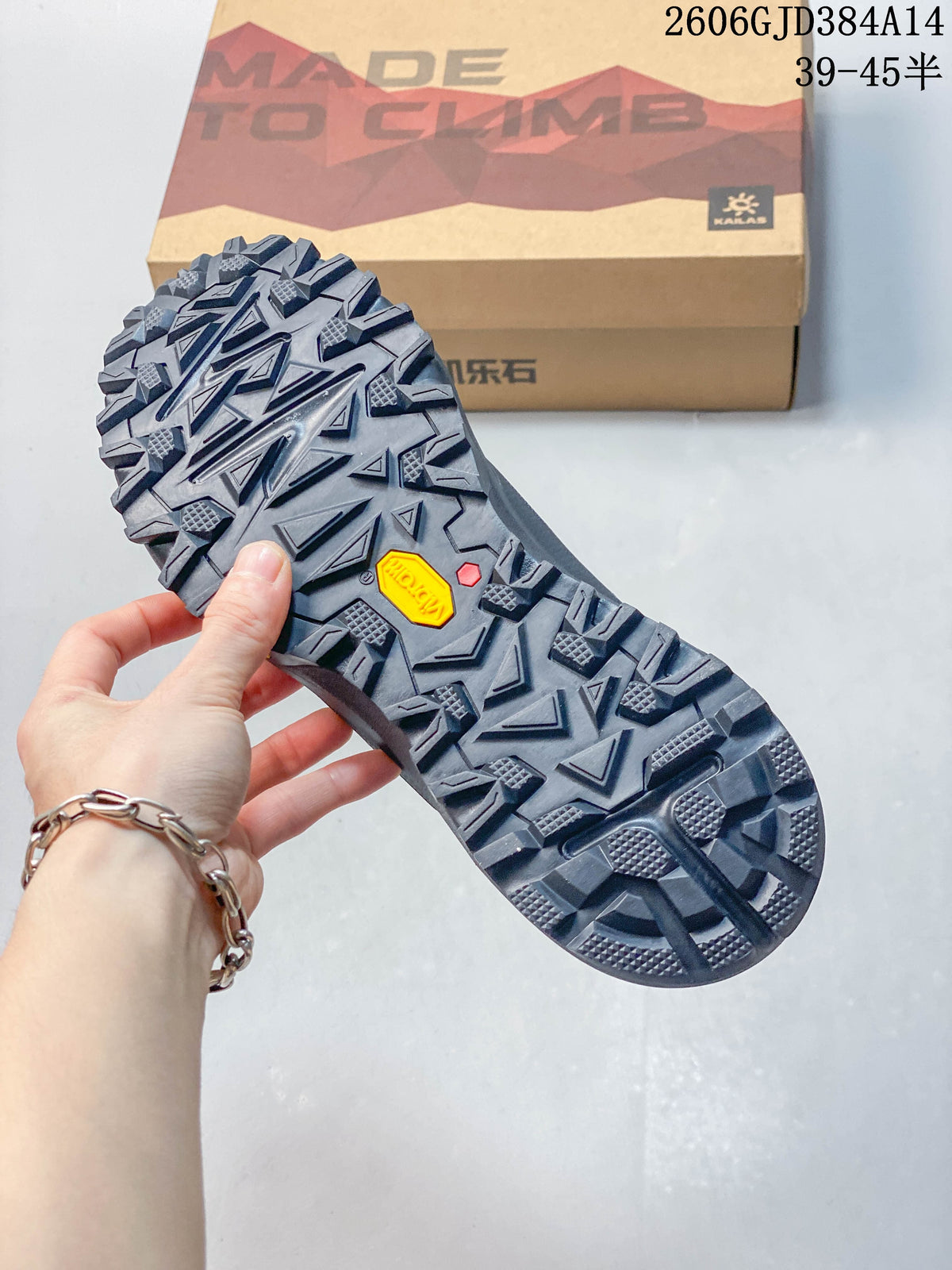 Close-up of the deeply lugged outsole with a Vibram mark