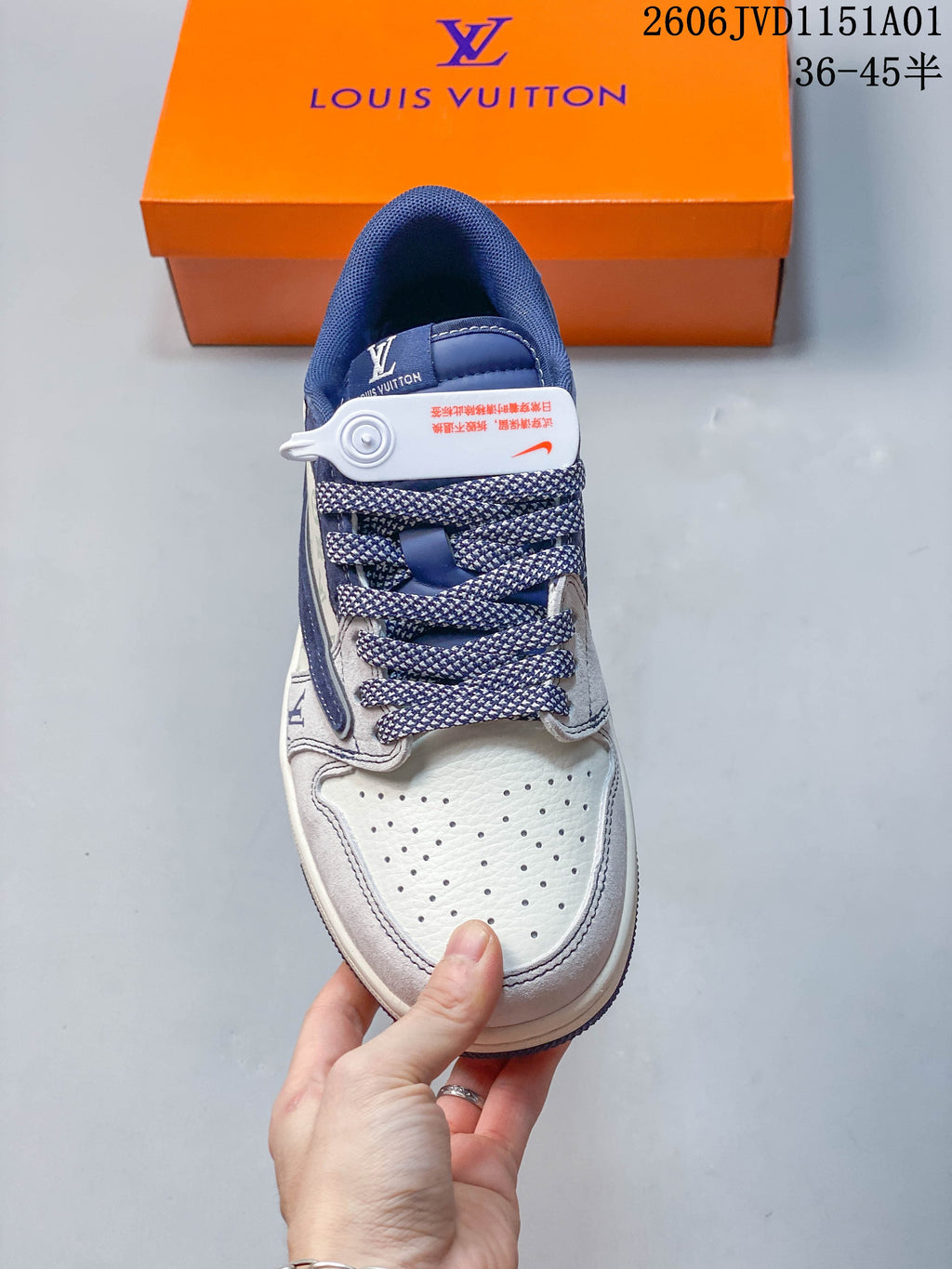 Top view showing perforated toe, patterned laces and blue tongue