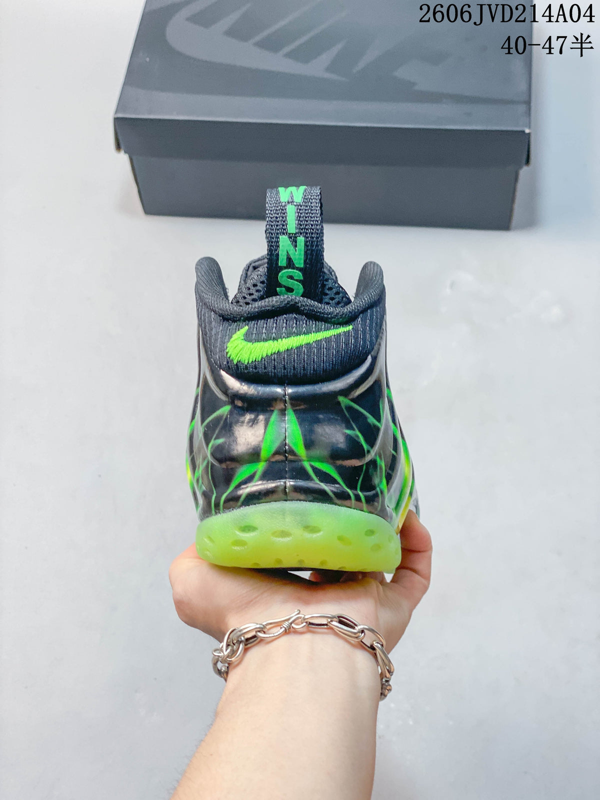 Rear view of a gray and green Nike Air Foamposite Pro shoe.