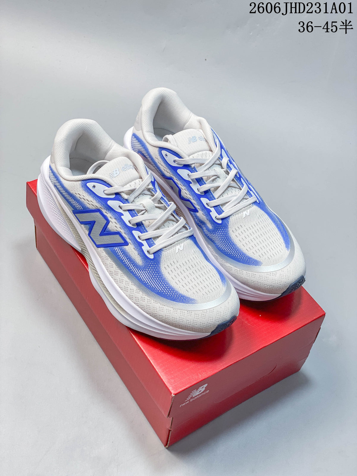 Pair of white and blue New Balance Ellipse v1 running shoes on a red shoebox