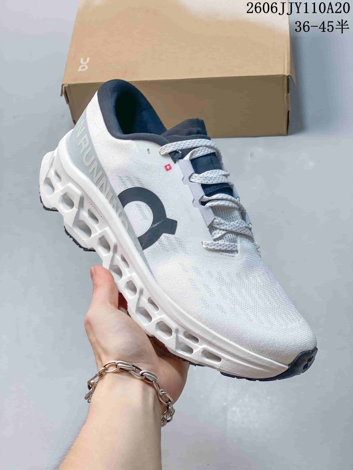Angled side view of the white On Cloudmonster 3 running shoe