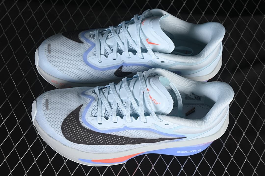 Pair of light blue Nike Zoom Fly 6 running shoes viewed from above.