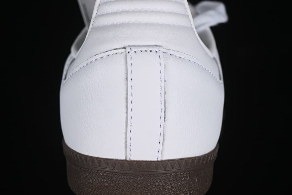 Rear view of the white sneaker and dark gum sole