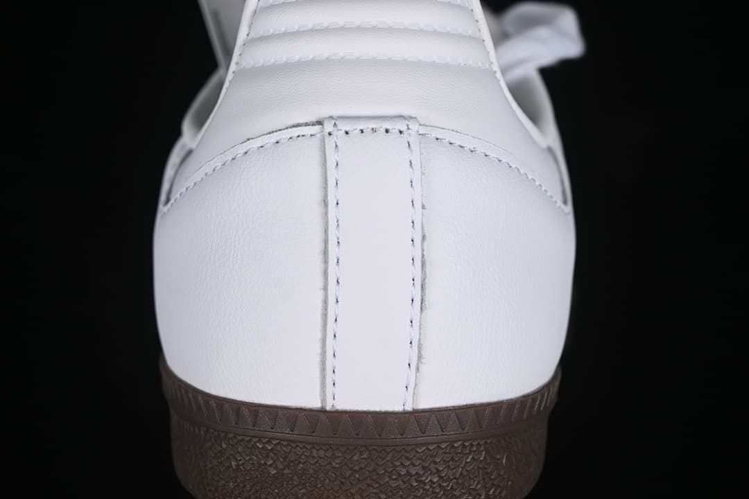 Rear view of the white sneaker and dark gum sole