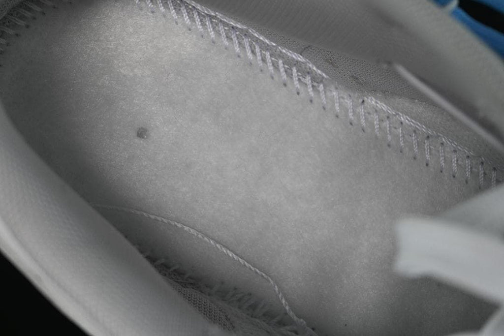 Close-up view inside the sneaker showing its lining and stitching