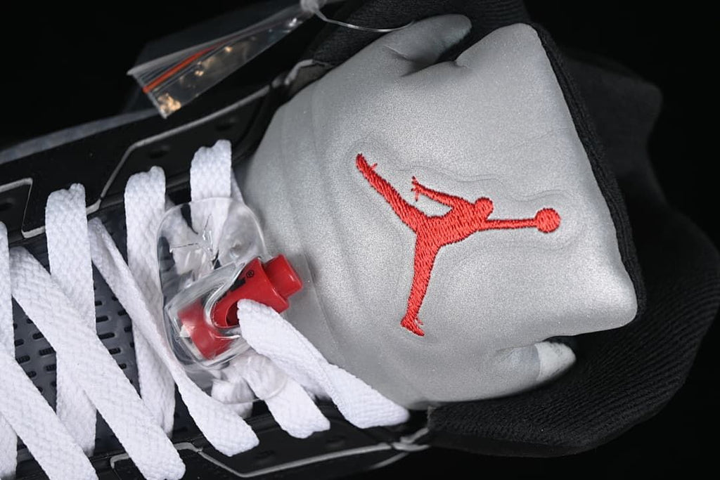 Silver tongue with red Jumpman and white laces