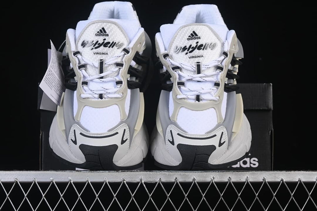 Front view of the pair highlighting the laces, toe panels and layered construction