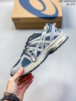 Side profile of the ASICS Gel-Kahana 8 sneaker showing layered overlays, side branding, and the midsole.