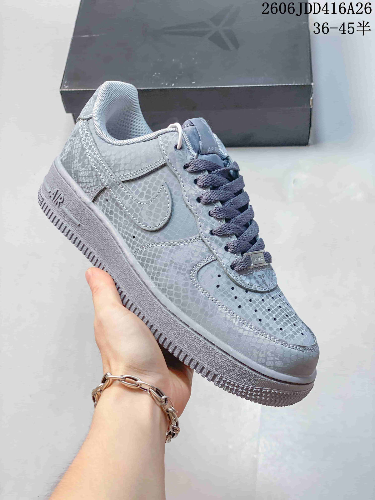 Close-up side view of a gray-toned textured low-top Nike Air Force 1 '07 sneaker.