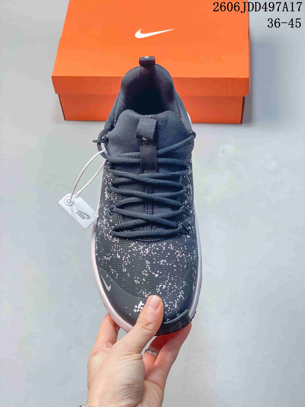 Top view of the Nike Free Metcon 7 shoe showing its laces and speckled upper