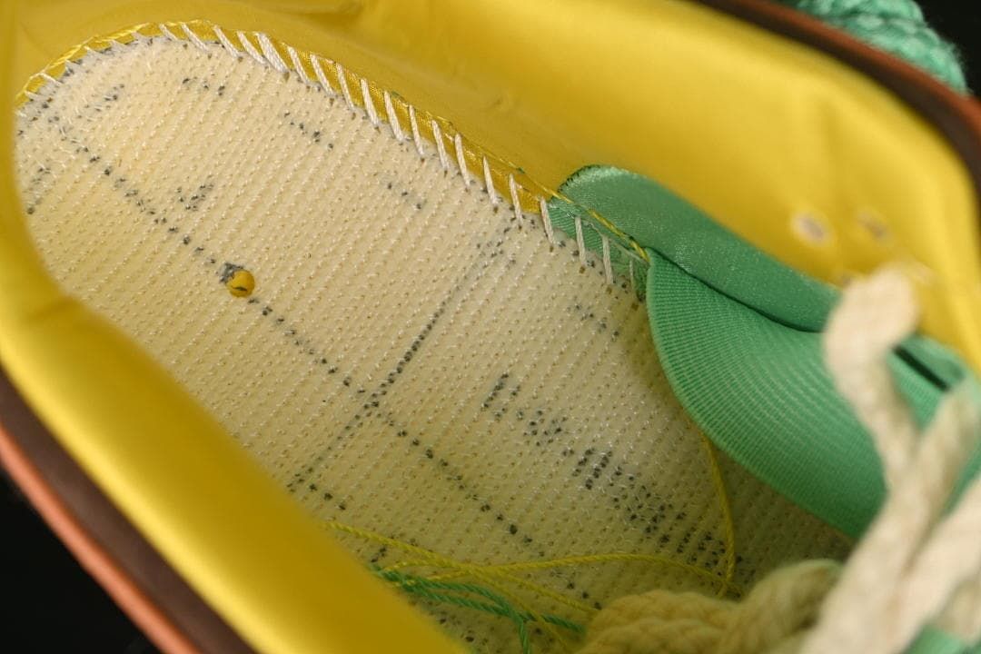 Close-up of the sneaker interior lining and stitched insole construction.