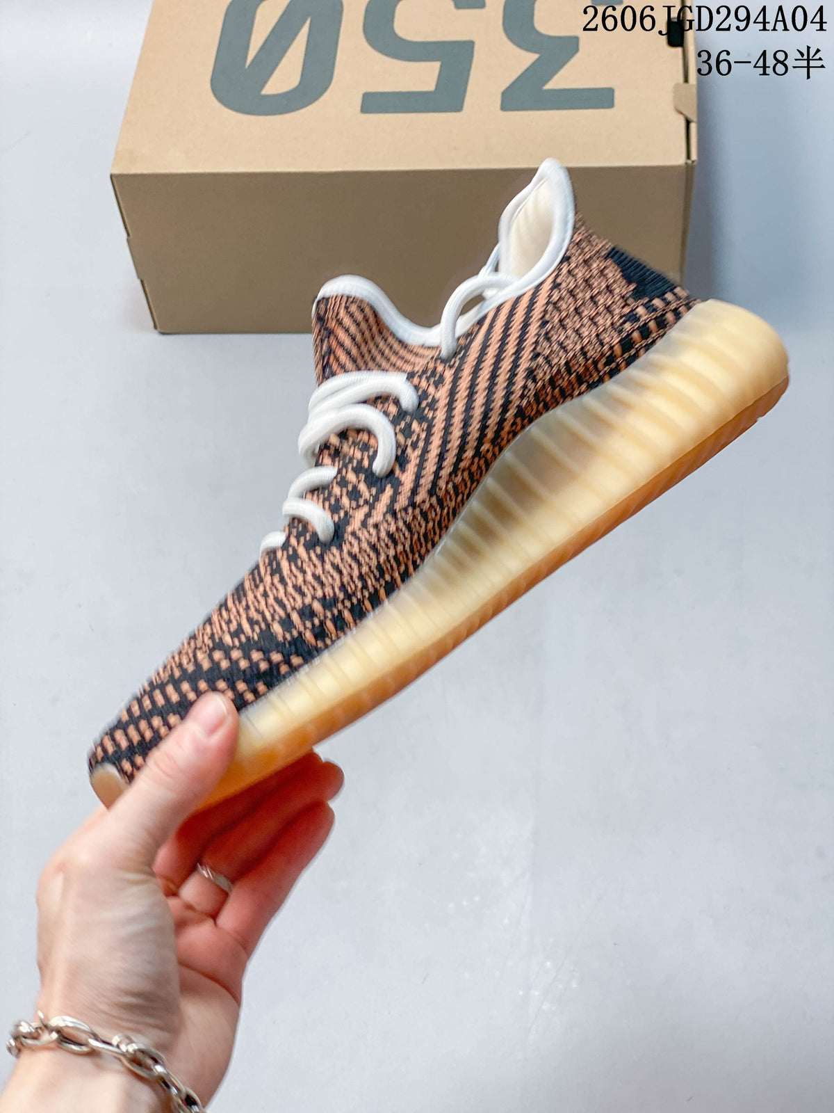 Side view of the patterned sneaker and ribbed amber-toned outsole
