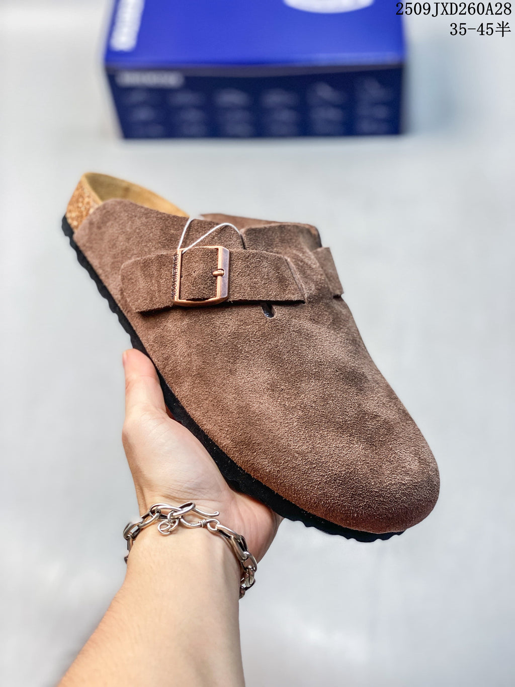 Angled view of the brown mule highlighting the buckle and low-profile sole