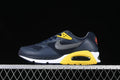 Side view of navy Nike Air Max Correlate sneakers with gray, yellow, and white accents.
