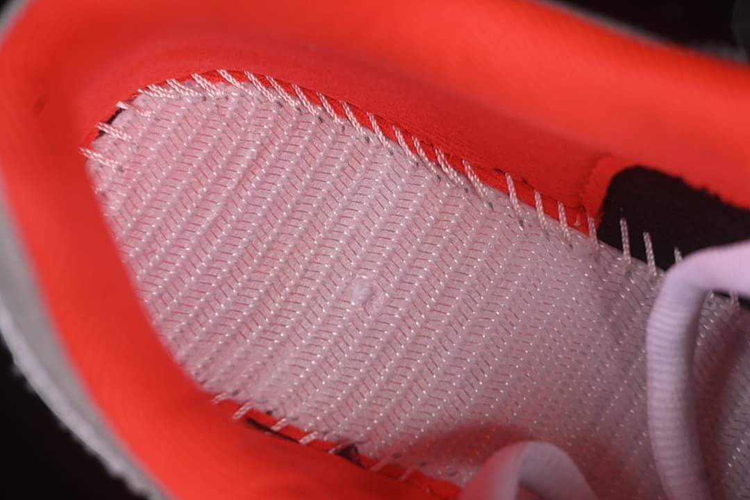 Close-up of the bright crimson inner lining and interior construction.