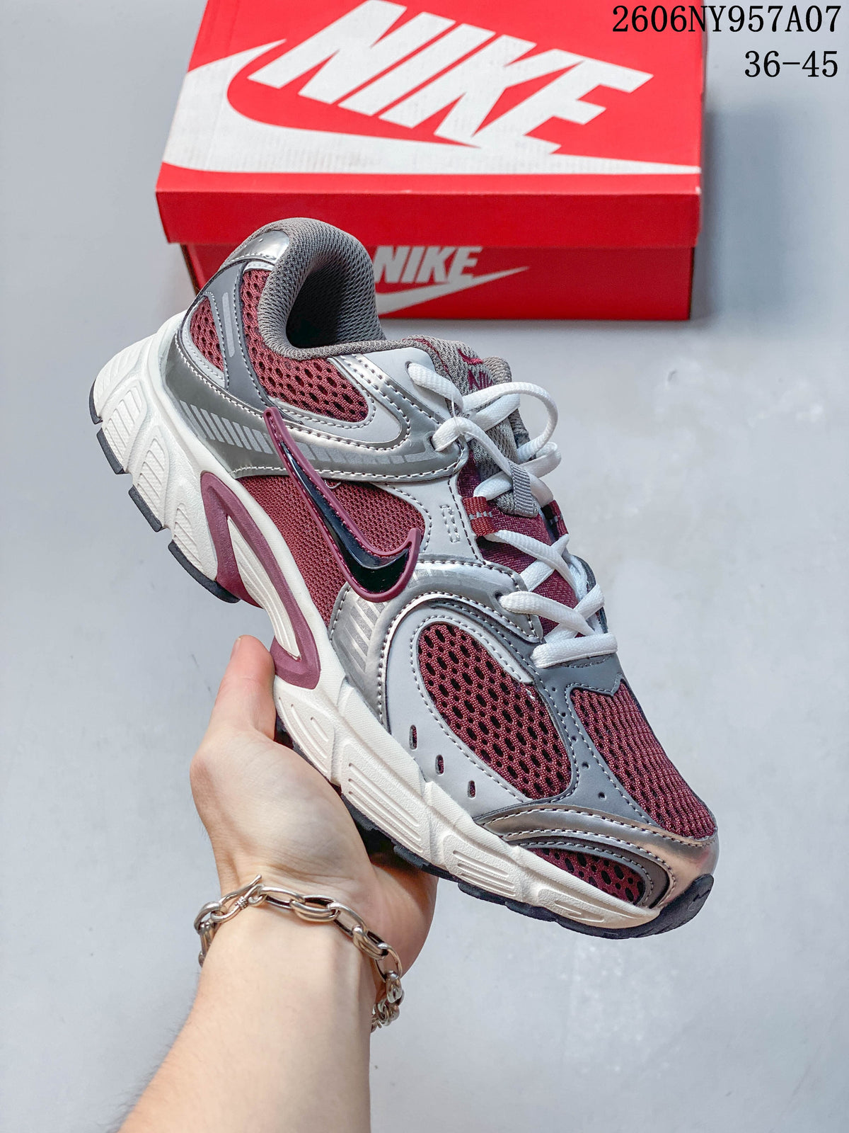 Angled side view of a burgundy, silver, gray, and white Nike V5 RNR sneaker.