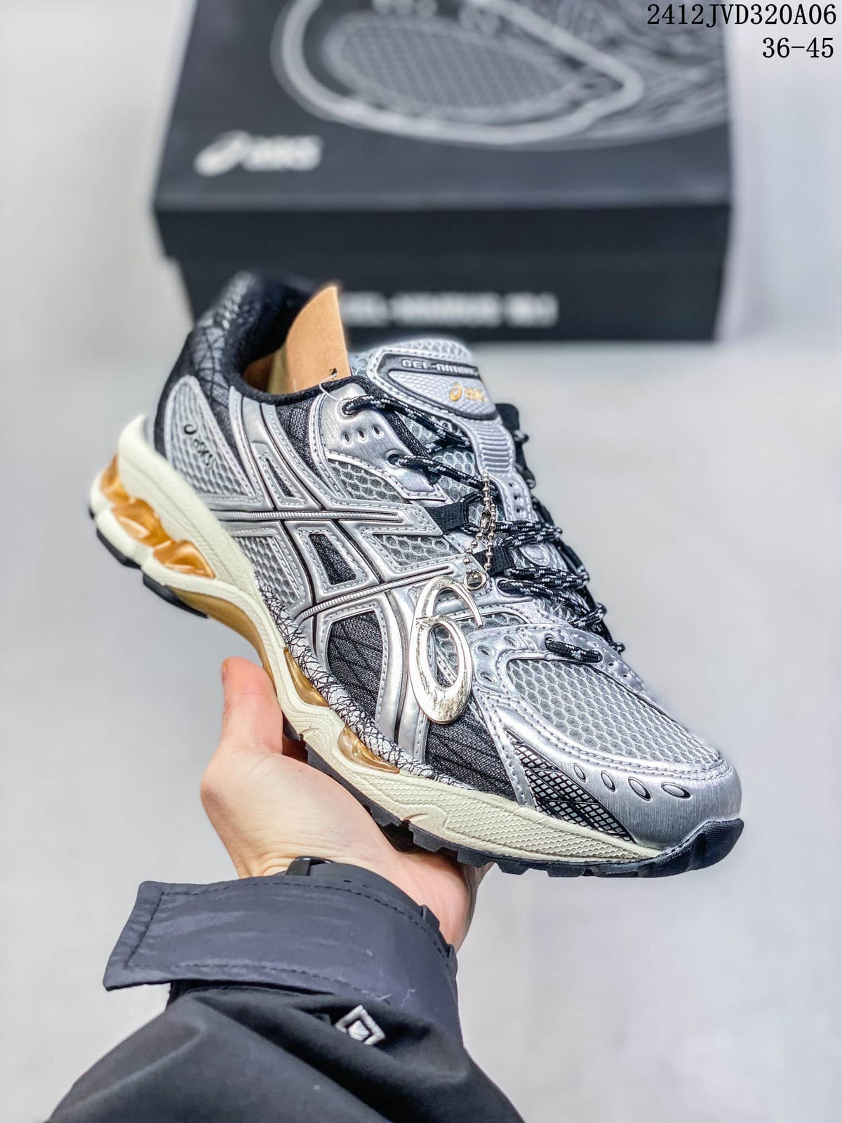 Angled side view of the silver and black ASICS GEL-Nimbus 10.1 sneaker