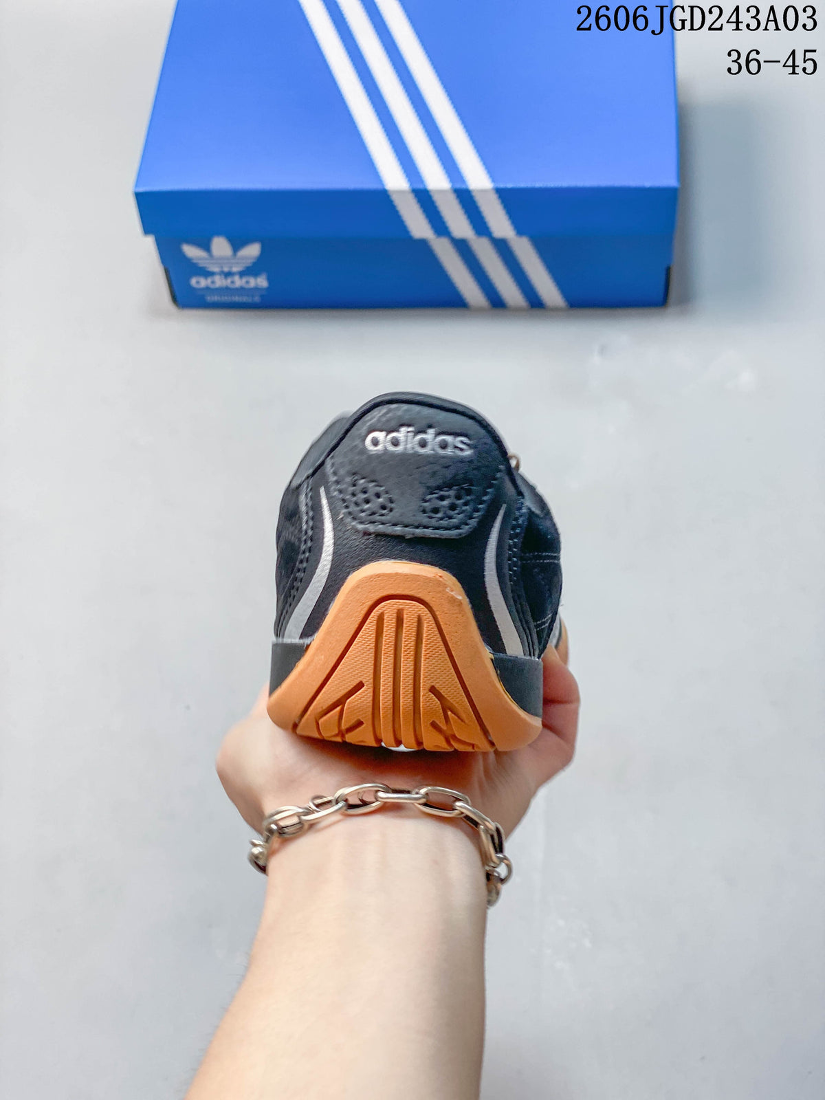 Rear view of the sneaker with a gum-colored heel outsole
