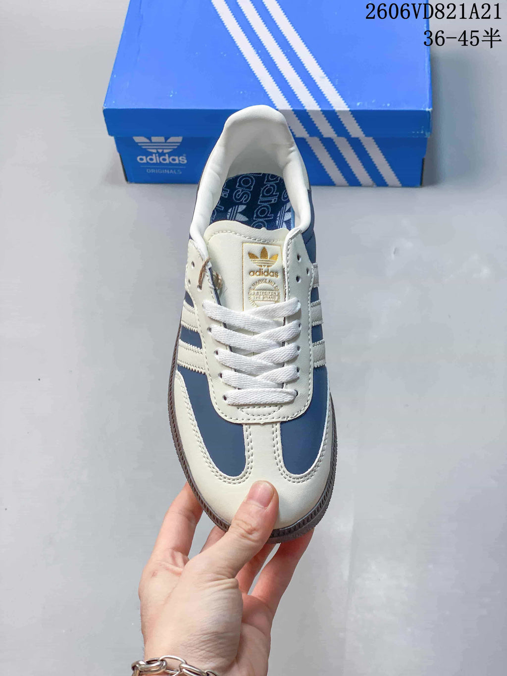 Top view of the lace-up sneakers with blue and white panels