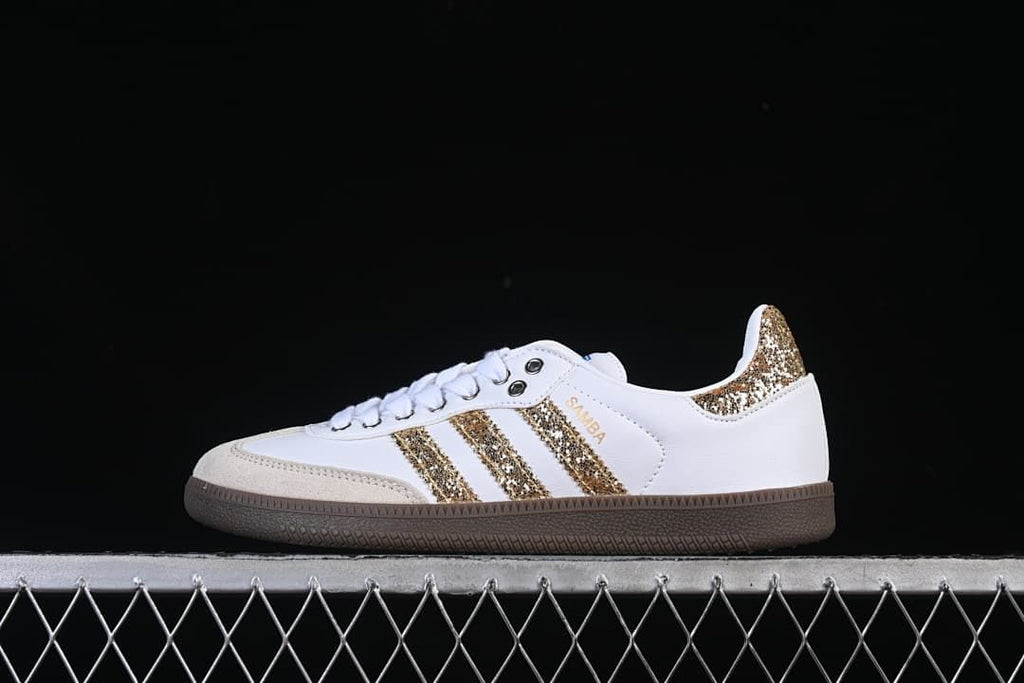 Side view of the white Samba OG with gold glitter-style detailing