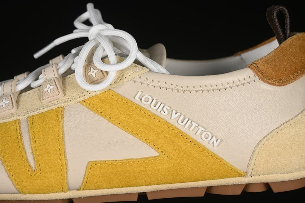 Close-up of the side panels, yellow detailing, lace tabs and branding