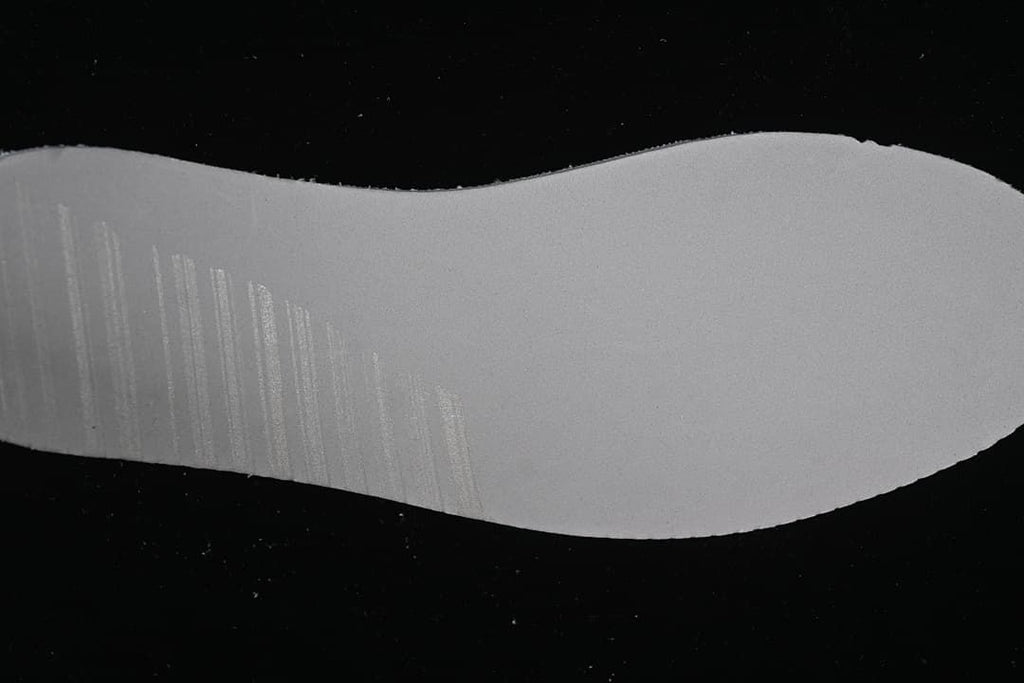 Light grey sneaker outsole shown from below