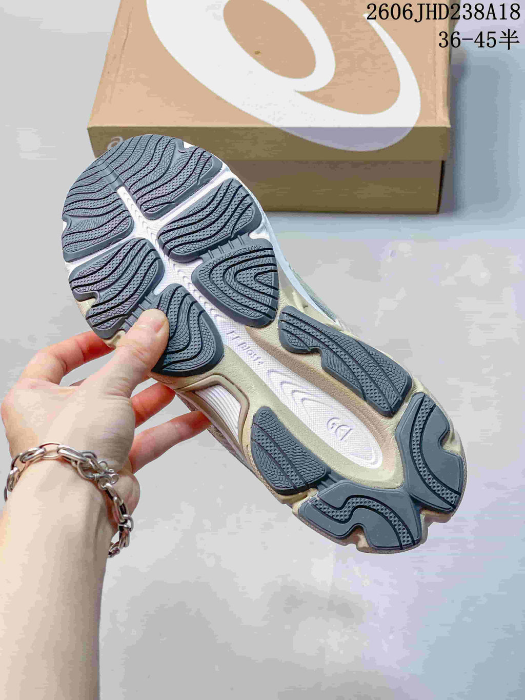 Close-up of the sneaker outsole with segmented dark gray tread