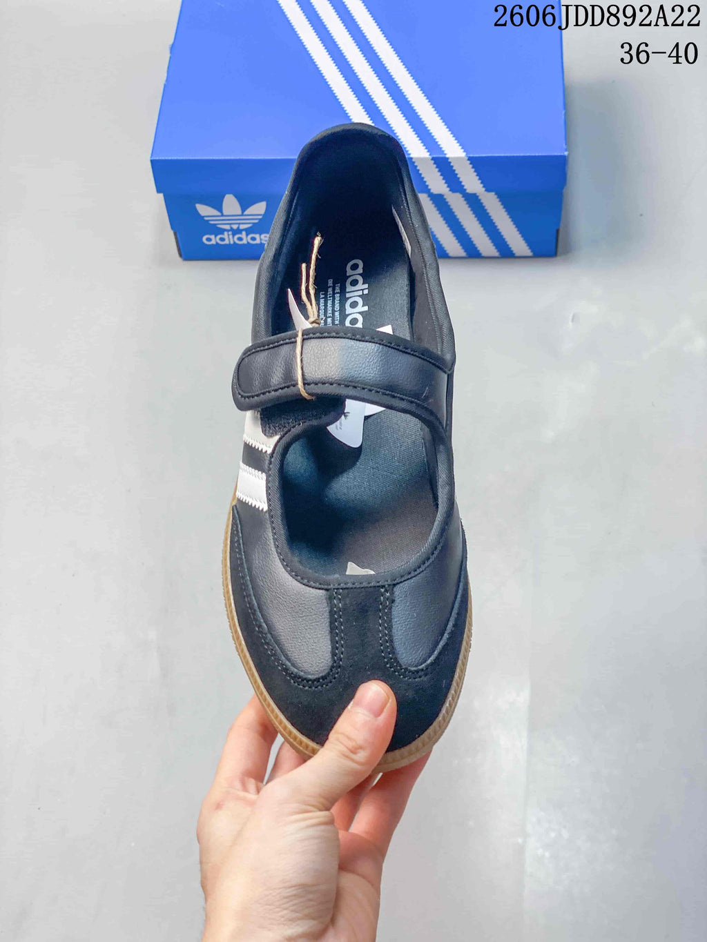 Top view showing the instep strap and rounded toe of a black adidas Samba Jane sneaker.