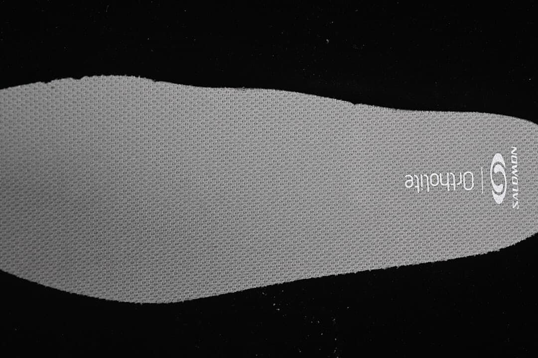 Close-up of a gray Salomon Ortholite insole.